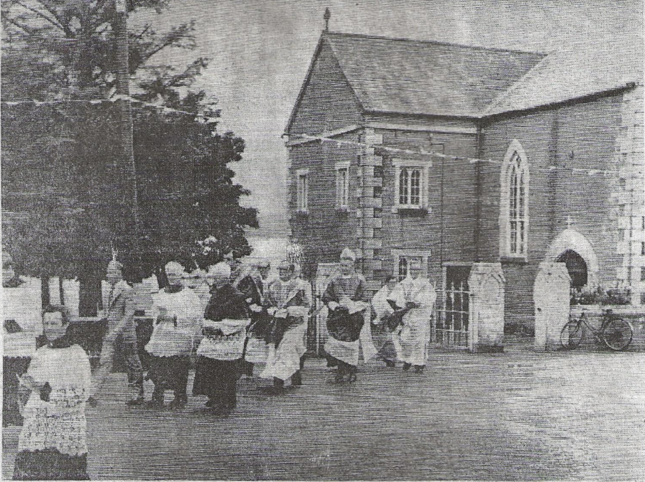 Image after the last mass in the old church, now the community centre, in procession to the new church across the road.
